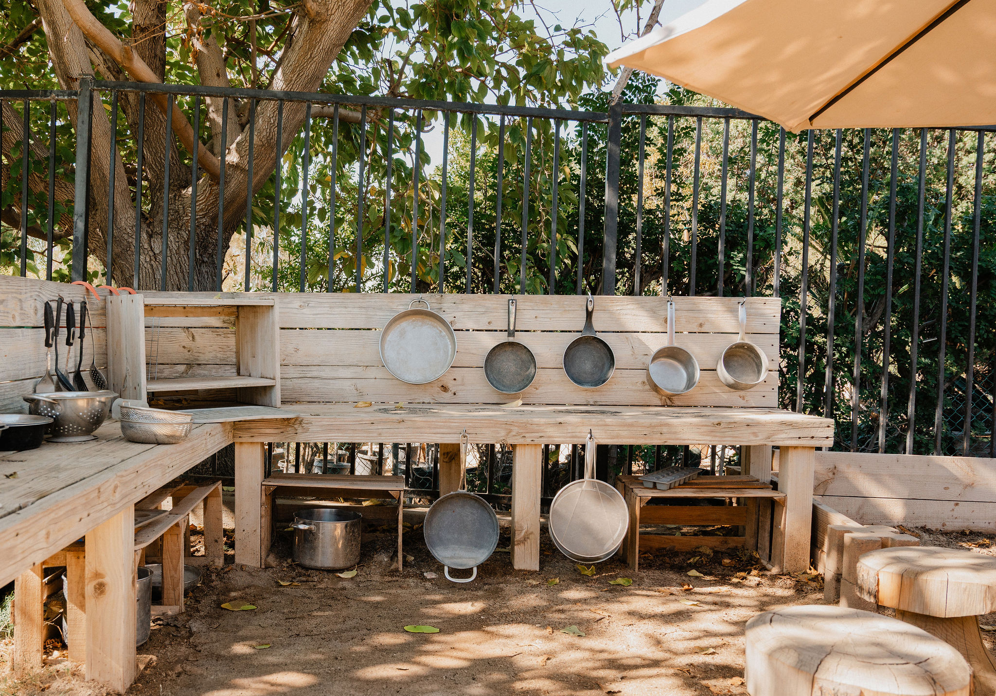 Outdoor music and exploration area for children at Orchard Atelier